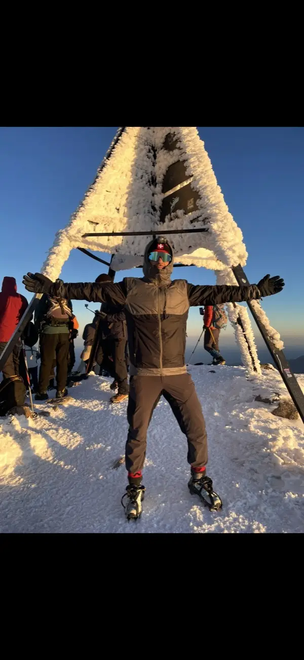Anas on a snowy mountain summit